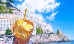 Ice cream cone in front of coast of Italy