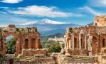 ancient ruins with mountain in background